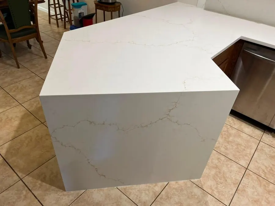 Kitchen island with a sharp mitered waterfall corner